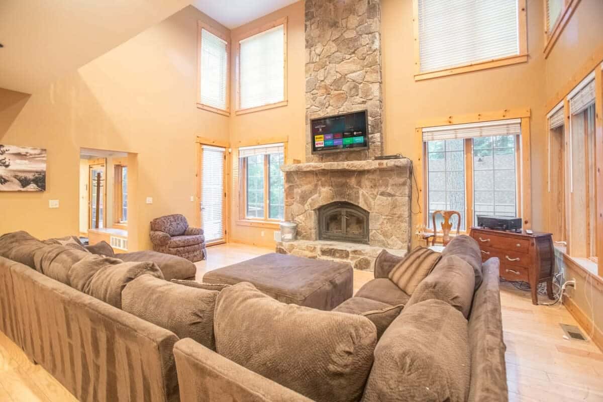 Settle into the large sectional sofa with plush oversized cushions as you warm up by the fire or enjoy a movie.