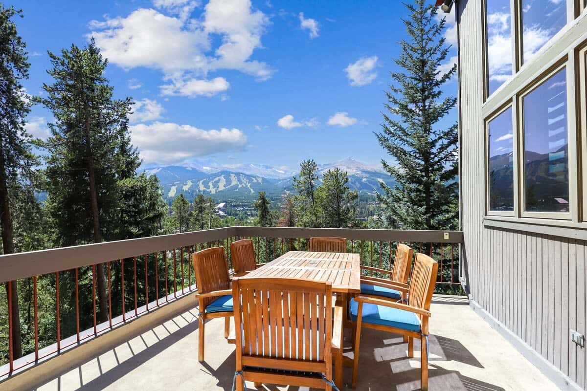 Third floor patio off of the sunroom with outdoor dining table and great ski resort views
