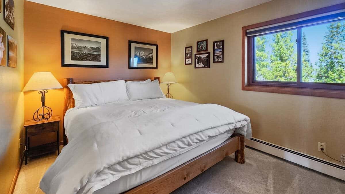 The master bedroom provides a comfortable place to rest and recharge with a king-size bed, TV, and an ensuite full bathroom.