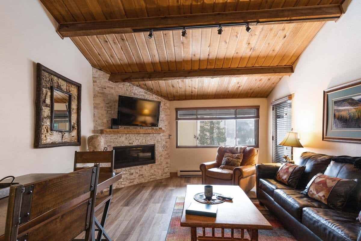 Living area with fireplace, flat screen TV and seating for 4