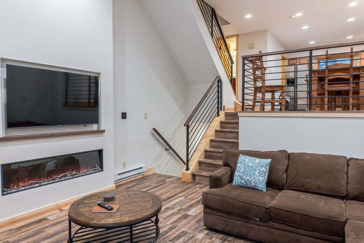 The main floor of the home is a split layout with the living room on one level and the kitchen and dining area on the other.