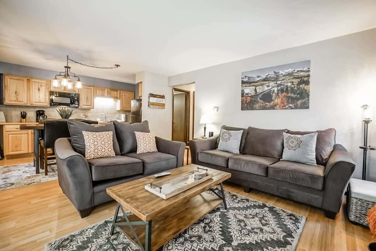 Relax in the cozy living room with a comfortable pullout sofa, indoor gas fireplace, and a flat-screen TV