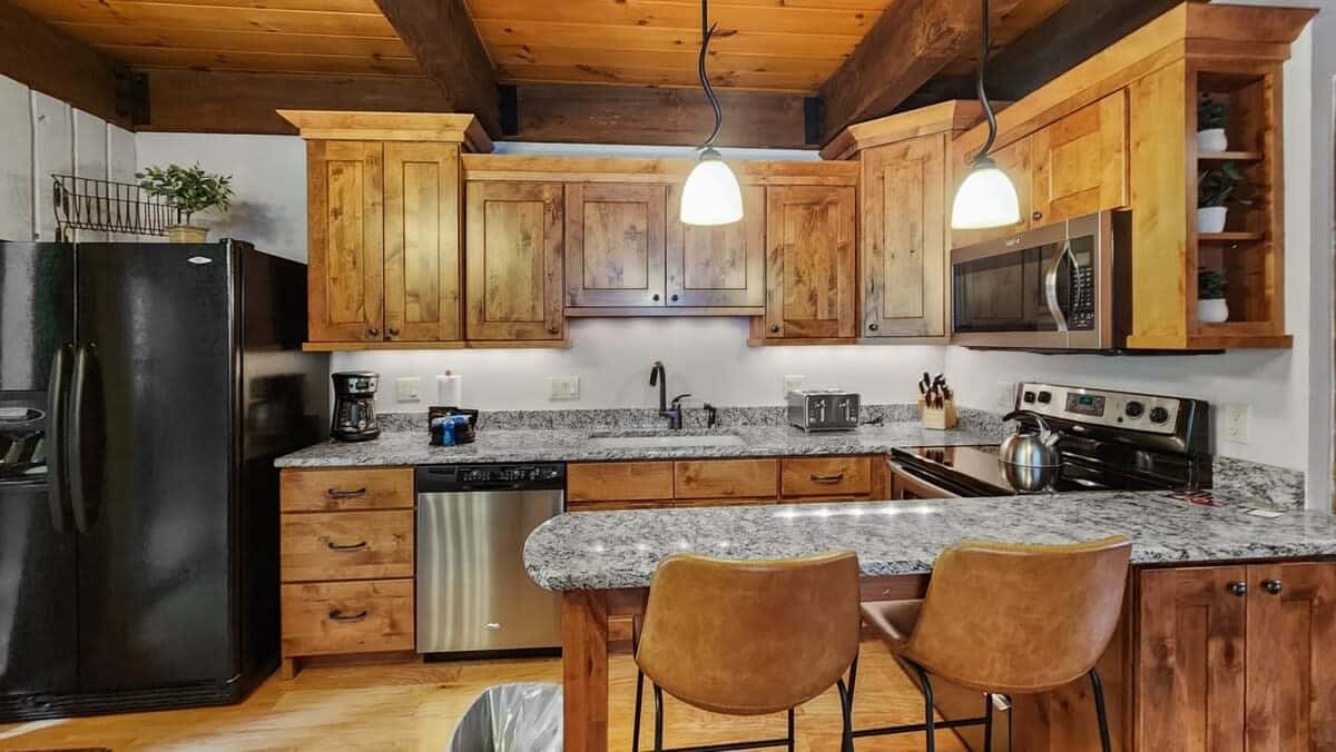 Kitchen: Drip coffee maker, Crockpot, blender, toaster, cooking utensils, tableware