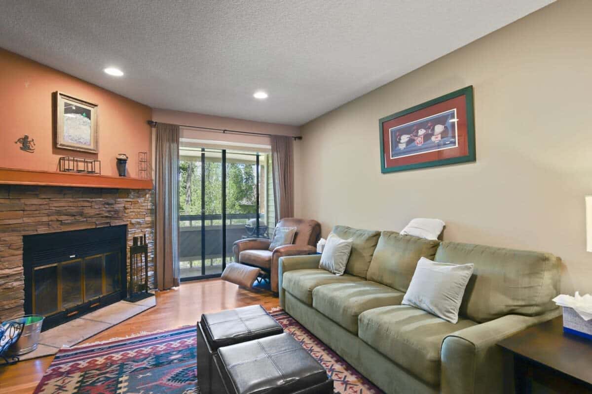 The plush couch doubles as a queen-size pull out bed while a nearby recliner makes the perfect place to unwind. Relax by the beautiful stone fireplace or access your intimate private deck space and take in the mountain vistas.