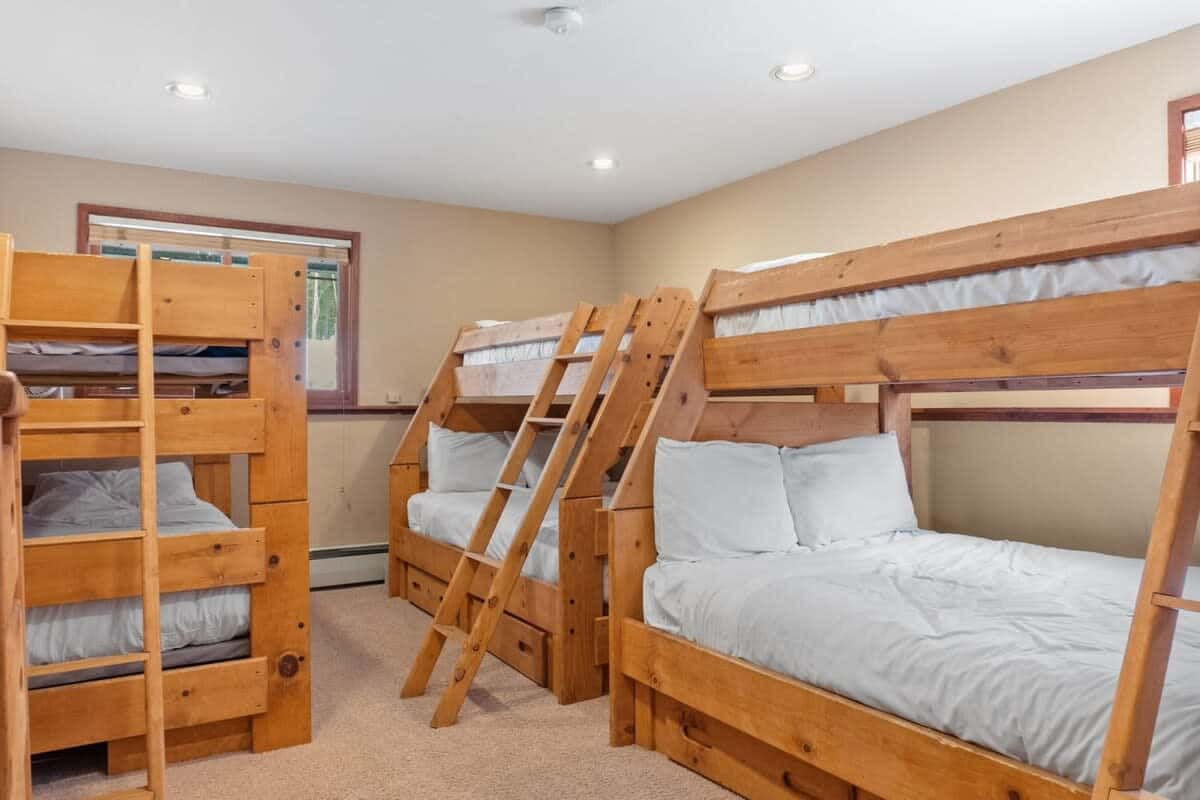 The home features four bedrooms, one of which is a bunk room with 3 sets of bunk beds providing plenty of space for your whole group to get a good night’s rest.