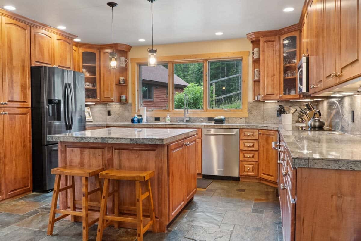 Kitchen: Drip coffee maker, Crockpot, blender, cooking utensils, tableware