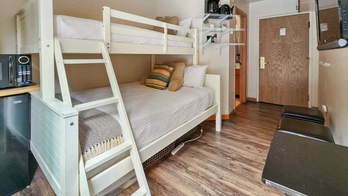 The dorm-style studio is perfect for couples or a solo getaway with a twin XL-over-full bunk bed providing enough space for 2-3 to stay together comfortably.