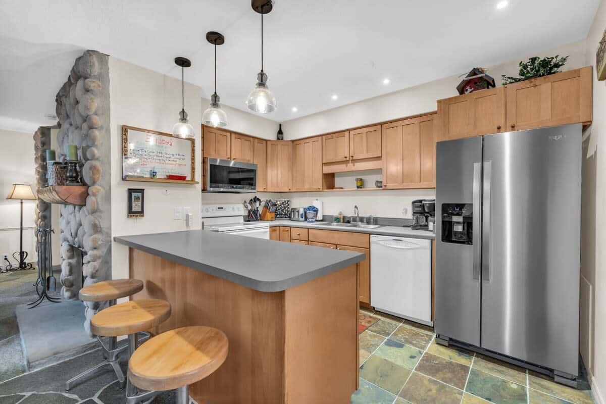 The fully-equipped kitchen has everything you need to prepare delicious meals at home and includes a breakfast bar seating for up to 3.