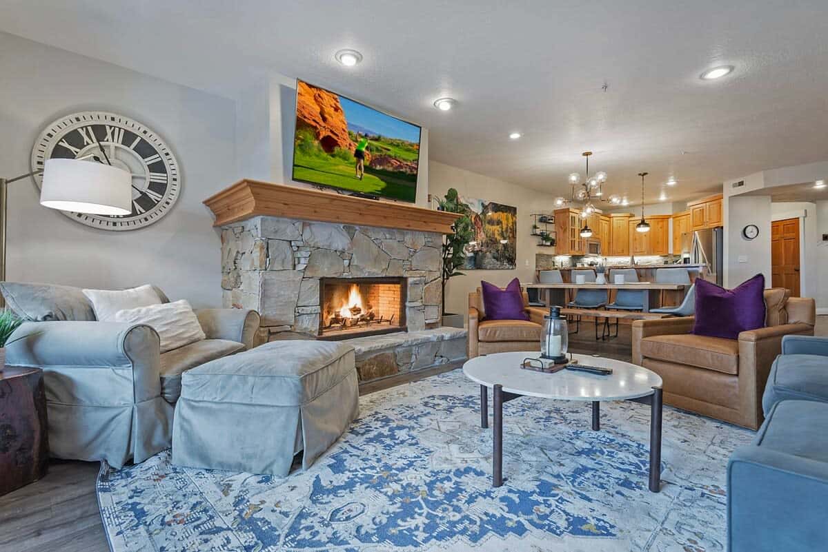 The well-decorated living room is connected to the dining area and kitchen, keeping you central to your group while you warm up by the fire and relax on the comfortable furniture.