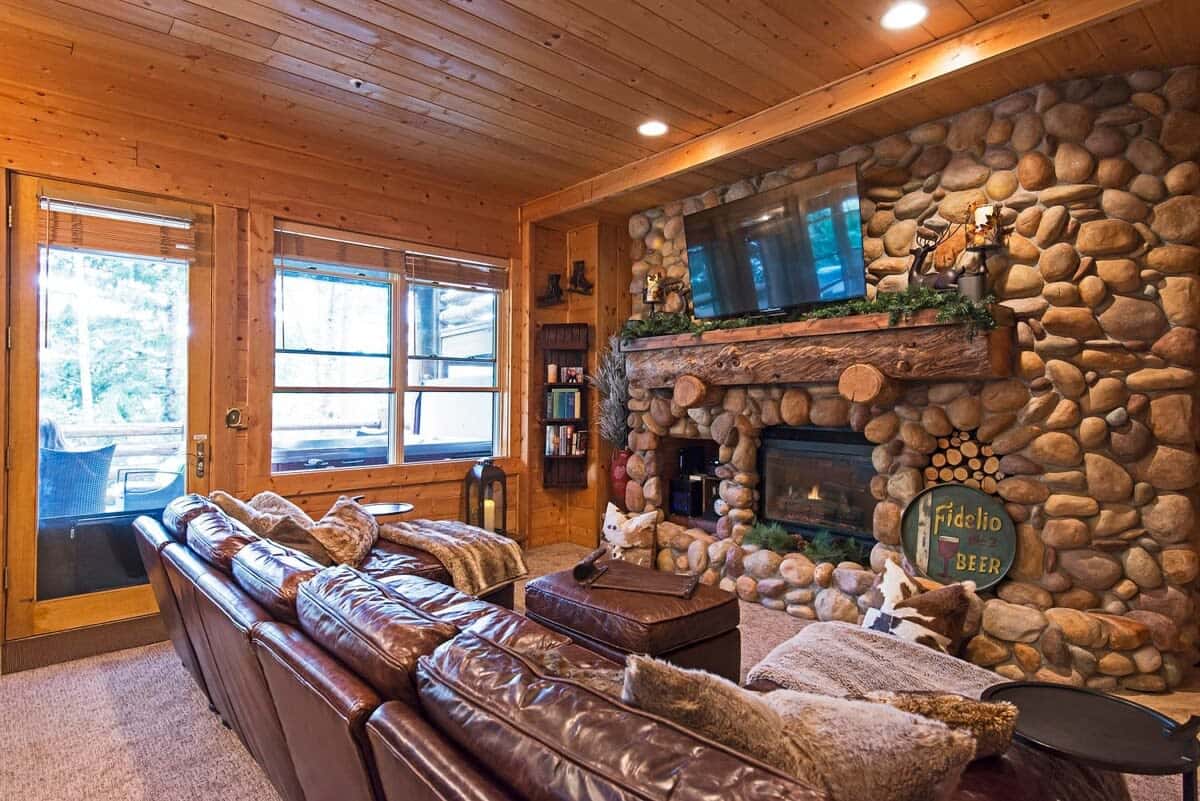 A one-of-a-kind river rock, gas fireplace and large flat-screen TV provide cozy comfort as well as entertainment for you to enjoy from the roomy leather sectional.