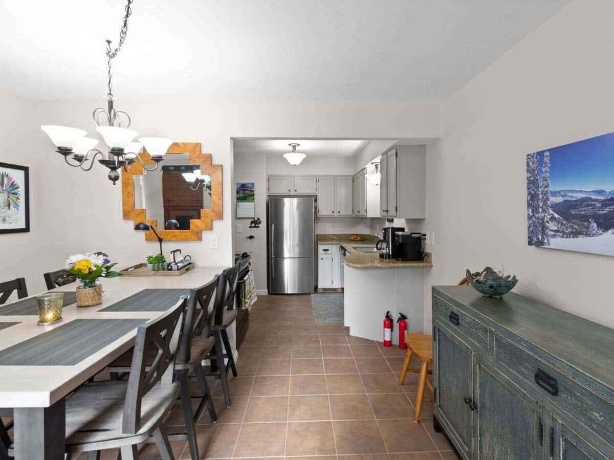 View of the dining area with plenty of seating for your group and the fully-equipped kitchen