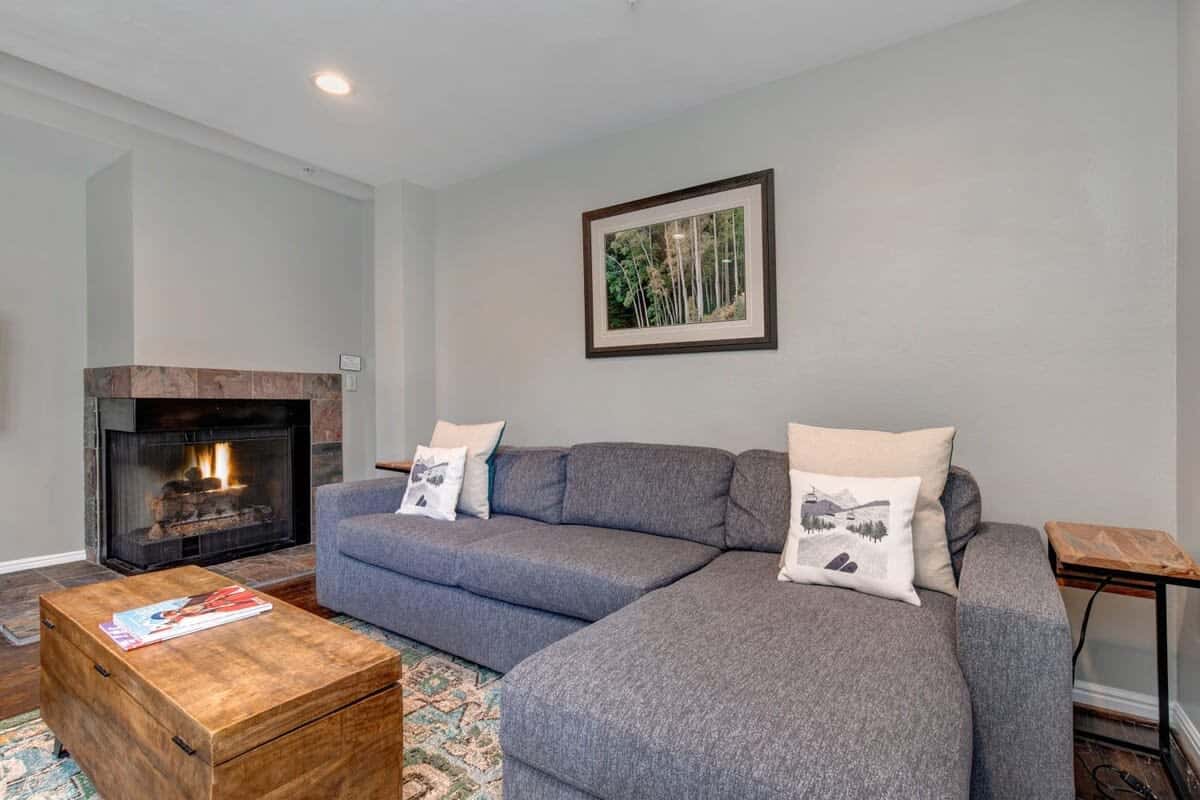 This plush sectional is perfectly situated by the fire for optimal comfort and relaxation. When it’s time to tuck in, you will be delighted to find that it doubles as a queen-size, pull-out bed.