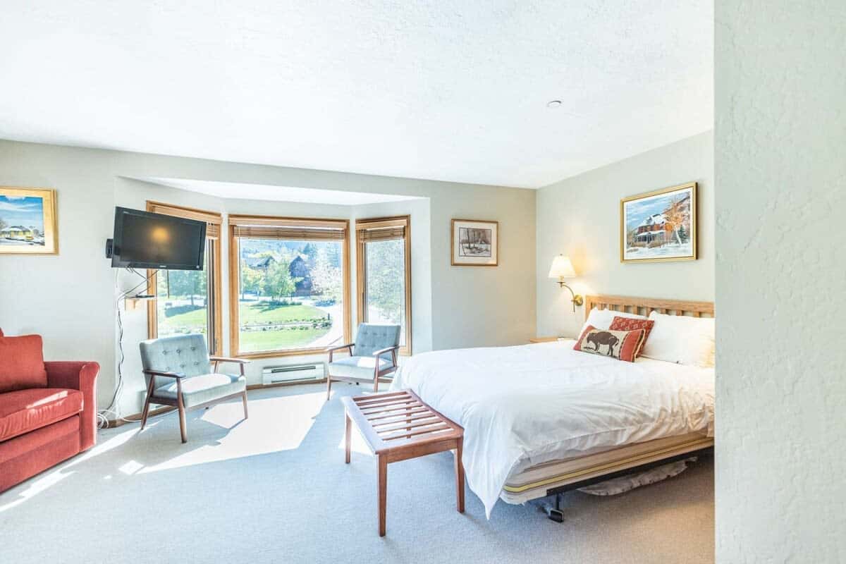 The spacious master bedroom boasts a lovely bay window flooding the room with natural light.