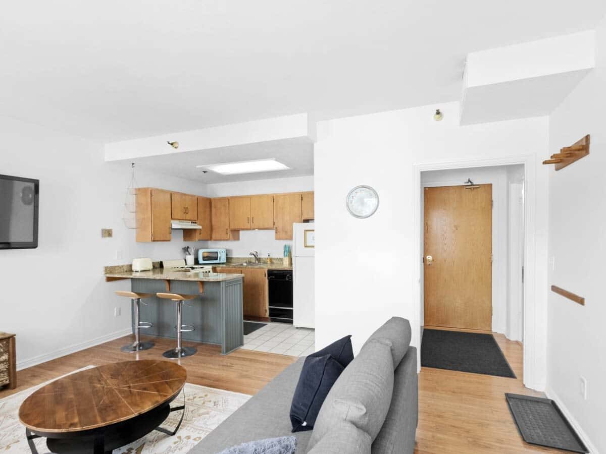 The light-filled open-concept kitchen/living/dining space is an intimate space that is full of vintage and modern charm.