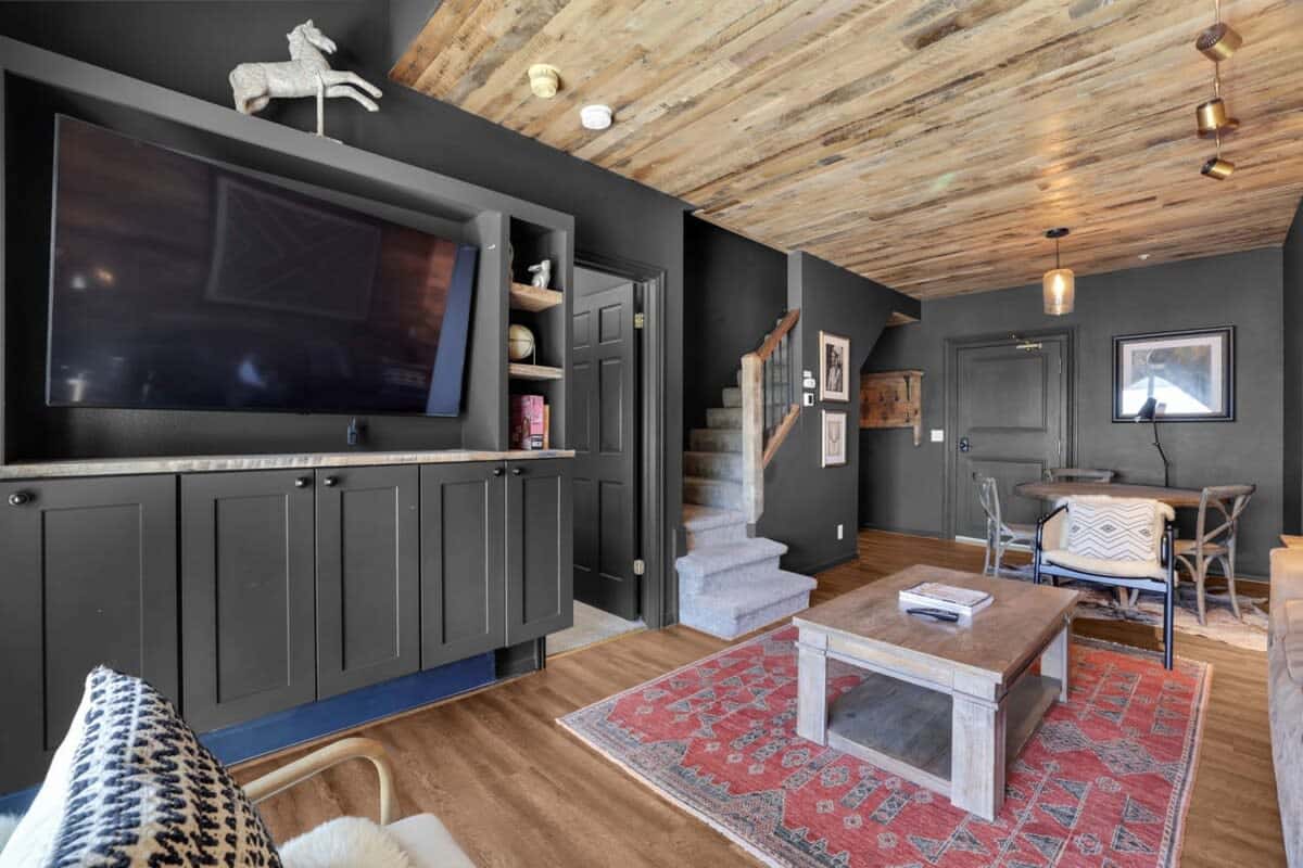 Relax in the comfortable living room while you can enjoy a movie on the 55” TV, or warm up by the corner gas fireplace while enjoying the views out the large window.