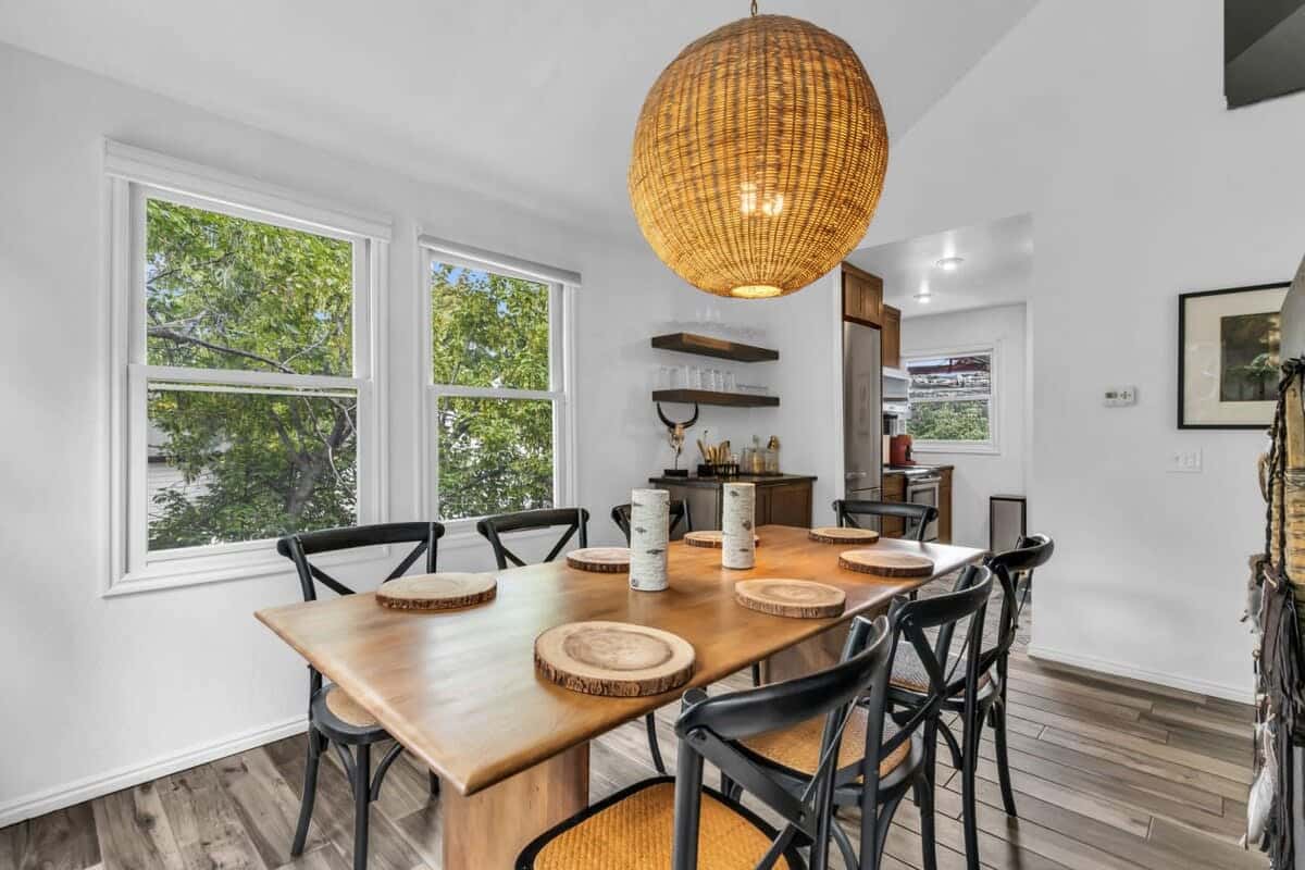 An inviting dining area is located just off the kitchen with enough seating for everyone in your group to sit together for a meal or work on a puzzle.