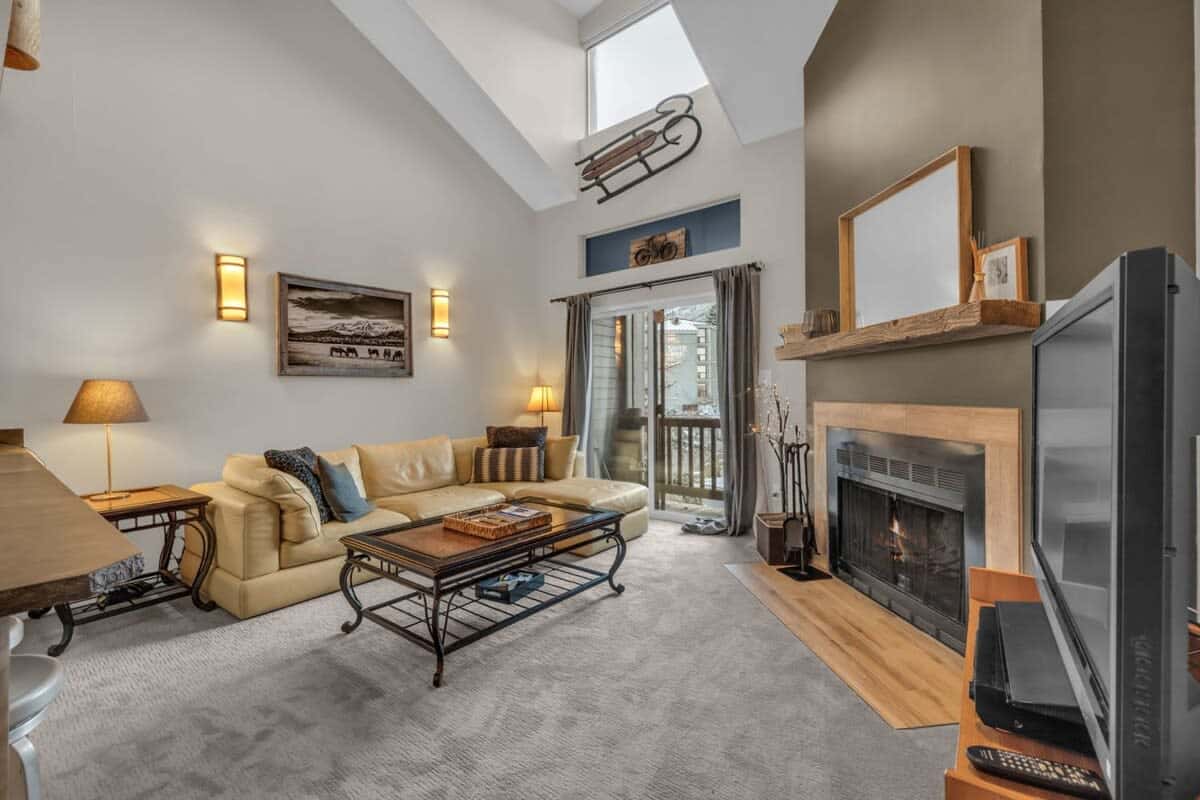 The cozy living room provides an inviting place to kick back and relax with your loved ones while warming up by the wood-burning fireplace.