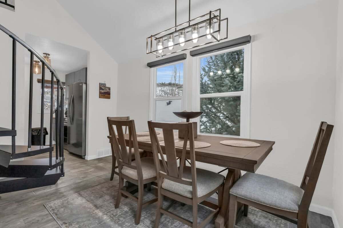 Enjoy meals with your group at the dining table, from which you can enjoy views all around from the large windows framing the surrounding trees.