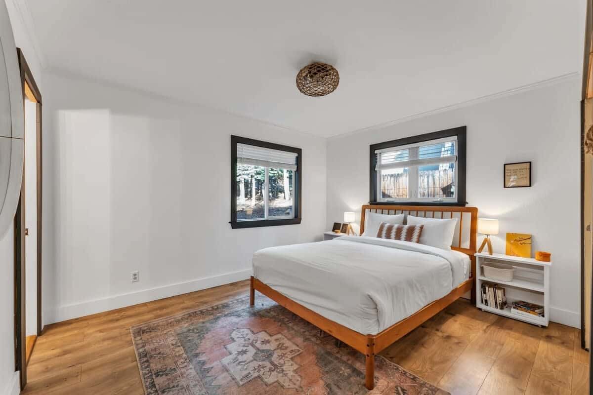 The master bedroom is filled with natural light from the two windows and includes an en-suite bathroom for ultimate privacy and comfort.