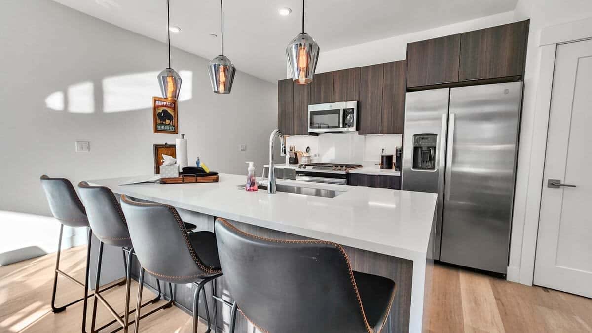 The beautiful kitchen is fully equipped with everything you need to prepare a delicious meal including stainless steel appliances and a spacious kitchen island with 3 bar stools.