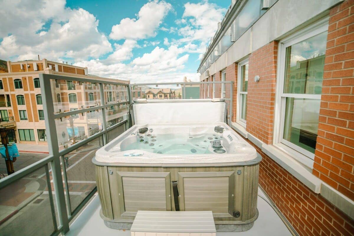 The private hot tub can fit four and enjoys views of the mountains and Main Street below.