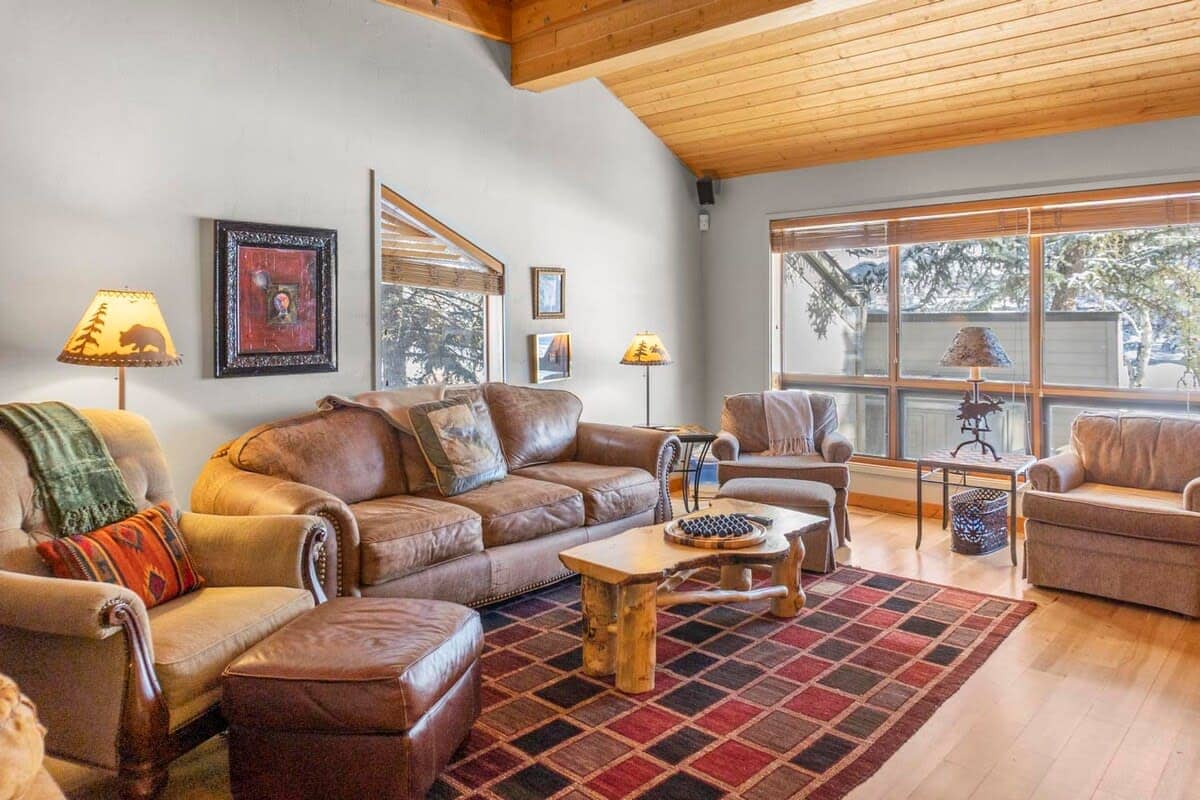 This rustic 3 bedroom, 3 bathroom townhome includes two different living rooms and a private hot tub providing a comfortable space to relax after a busy day exploring.