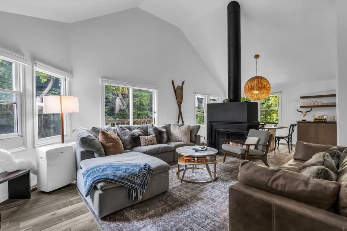 This stylish condo is filled with windows overlooking the trees creating a treehouse vibe that you and your guests will love!