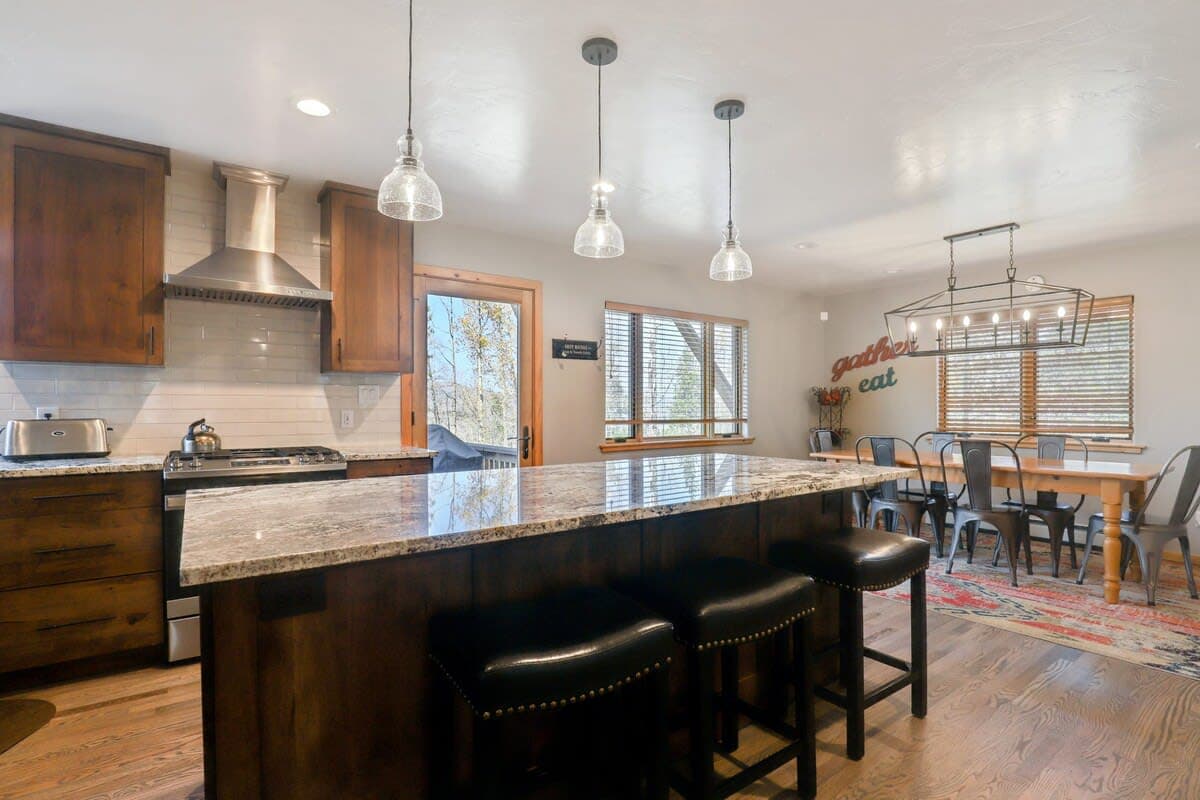 Brand new kitchen with stainless steel appliances and granite countertops