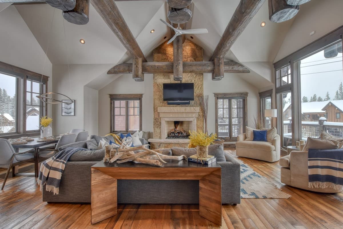 Living room with gas fireplace, mounted TV and beautiful furniture