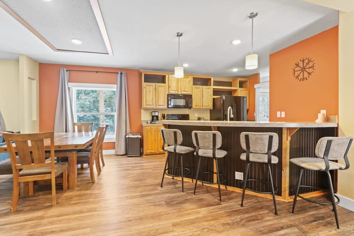 The open layout kitchen/dining/living area creates a large dynamic space for your group to relax together.