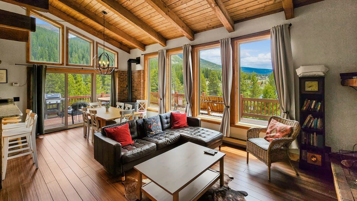 Living room: TV with cable, wood-burning fireplace, electric baseboard heating, no A/C 