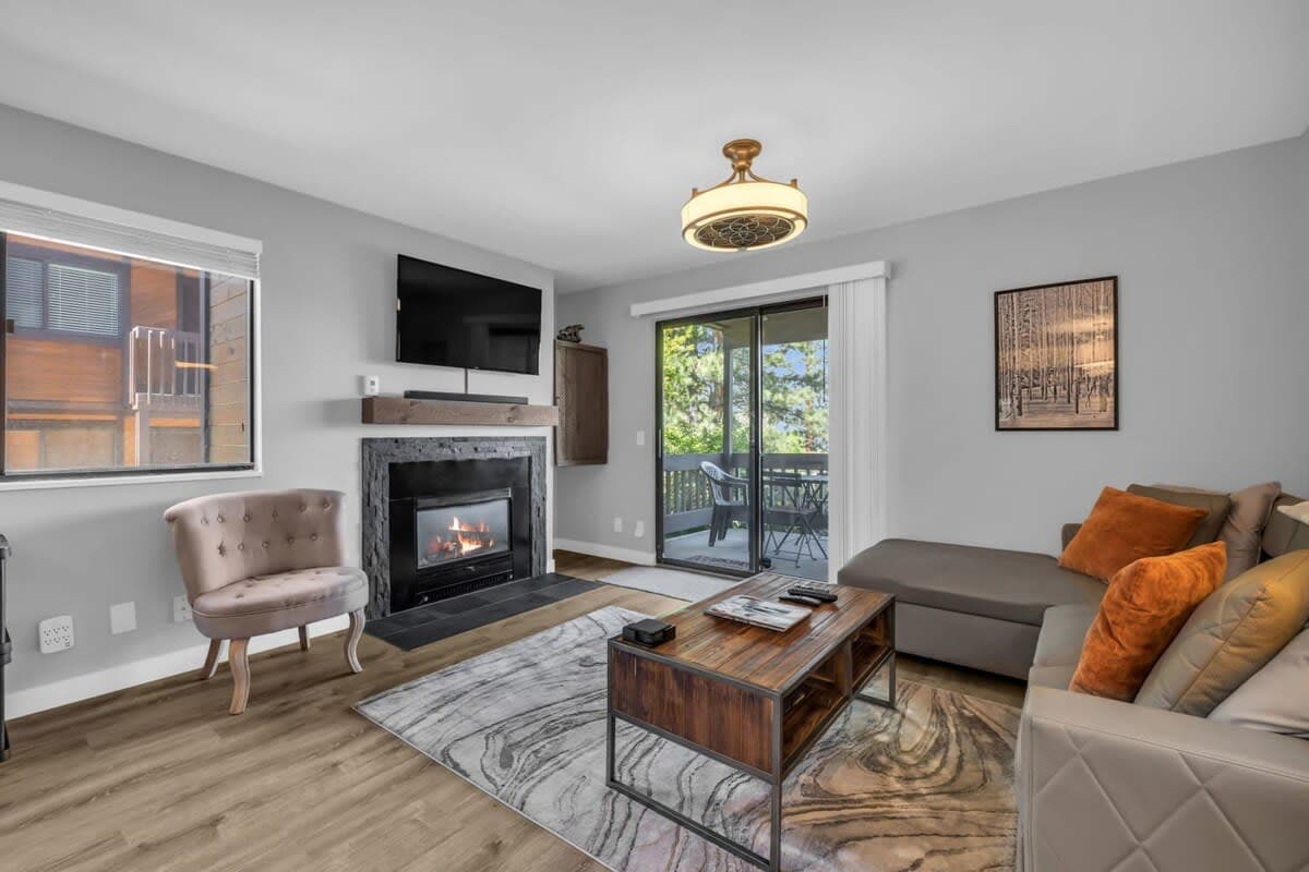 As you step into this lovely home, everything is at your fingertips, from the warmth of the gas fireplace to the comfy leather couch.