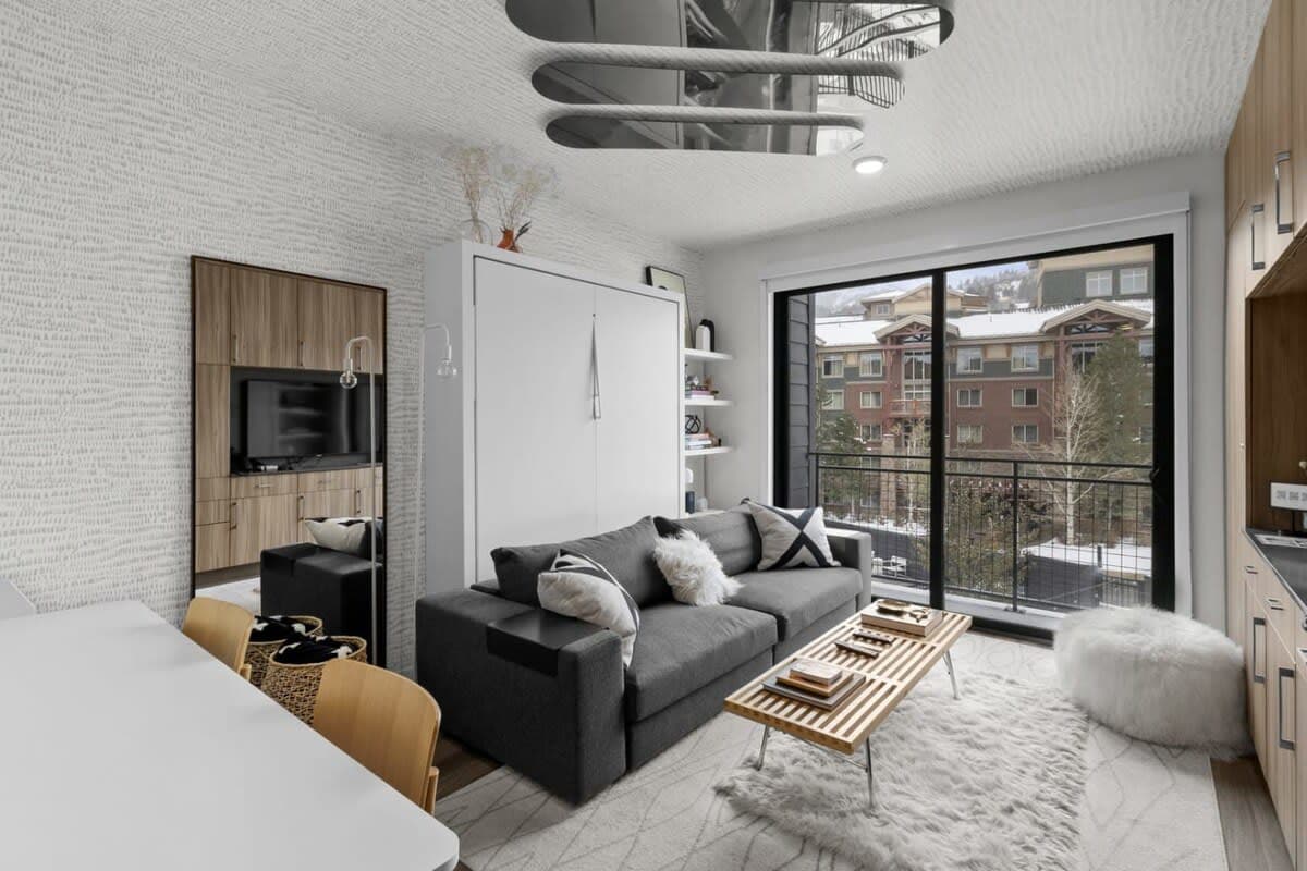 Living area: 50-inch Smart TV with Xfinity cable, Apple TV, and Nintendo, central heat and A/C (building controlled)